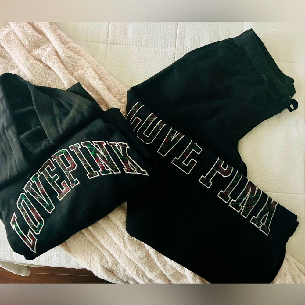 PINK women’s black fleece hooded sweatshirt and fleece sweat pants.
